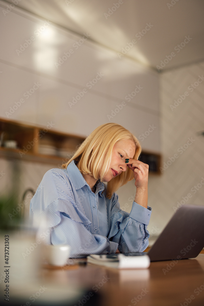 Tired blonde young woman, having a hard, busy day at work. Tired blonde young woman, having a hard, busy day at work.