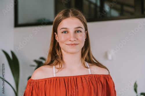 Teenage girl smiling at home