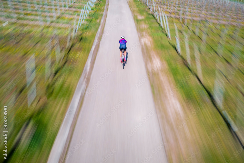 Active young man riding bicycle on road Active young man riding bicycle on road