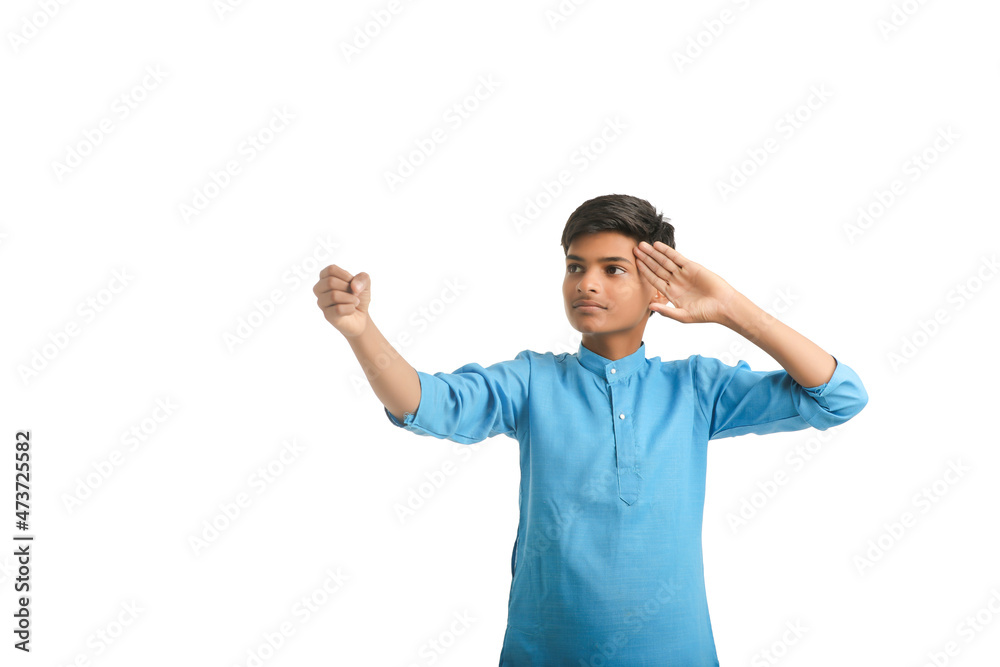 Fototapeta premium Indian boy in traditional wear and giving hand expression on white background.