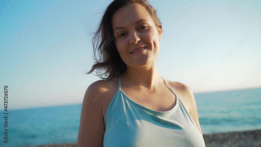 Portrait beautiful woman on the sea. Happy female on the beach. Girl close-up, the wind fluttering hair. Spring portrait on the beach. Young pretty girl. Young smiling woman outdoors portrait Portrait beautiful woman on the sea. Happy female on the beach. Girl close-up, the wind fluttering hair. Spring portrait on the beach. Young pretty girl. Young smiling woman outdoors portrait