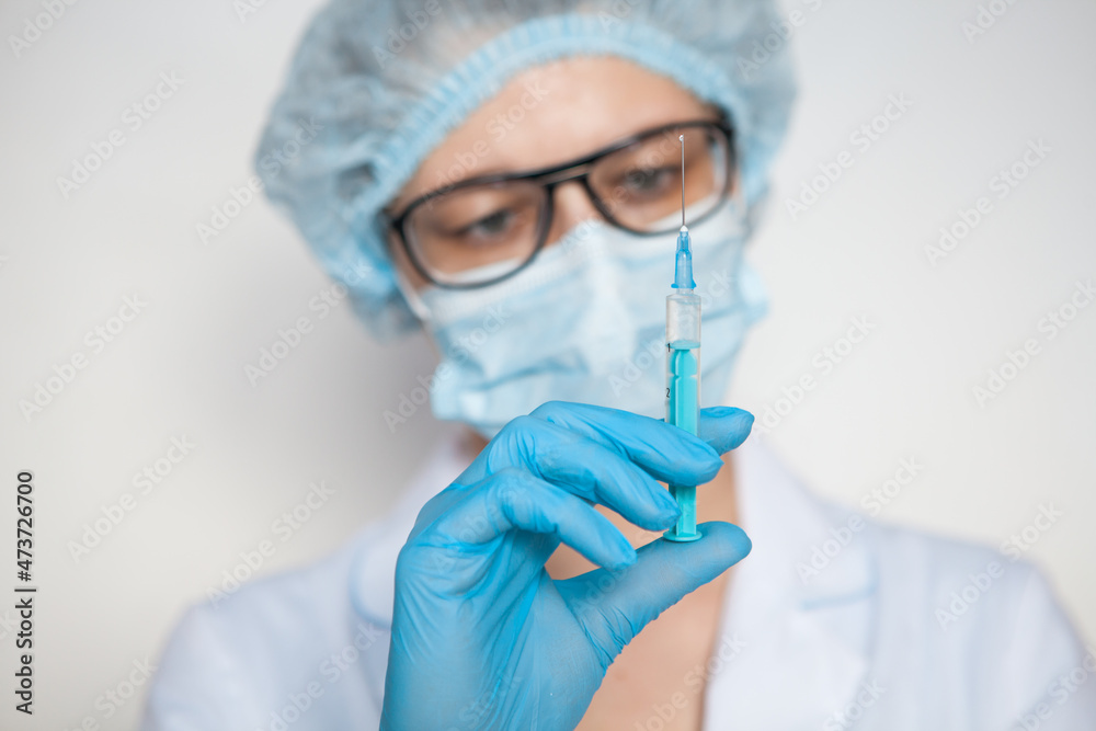 Doctor, nurse, scientist hand in blue gloves holding flu, measles, coronavirus, covid-19 vaccine disease preparing for child, baby, adult, man and woman vaccination shot, medicine and drug concept. Doctor, nurse, scientist hand in blue gloves holding flu, measles, coronavirus, covid-19 vaccine disease preparing for child, baby, adult, man and woman vaccination shot, medicine and drug concept.
