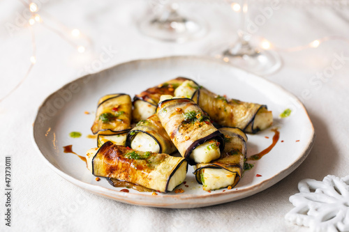 Vegetarian canapes of halloumi cheese wrapped in grilled aubergine photo