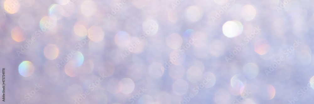 Obraz premium bright glitter background: bokeh effect from many colored lights on frozen glass, toning