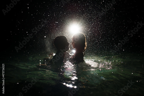 Magical night swim for lovers photo