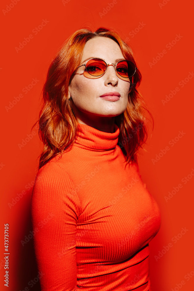 Stylish redhead gorgeous woman looking at camera Stylish redhead gorgeous woman looking at camera