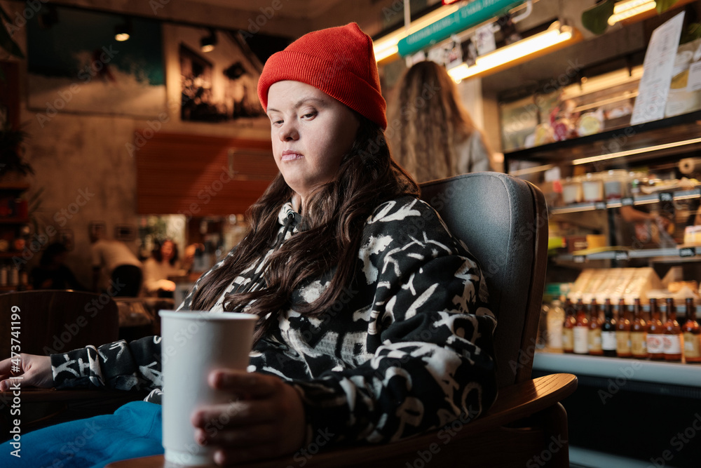 © Clique Images/Stocksy - Young Woman In Cafe