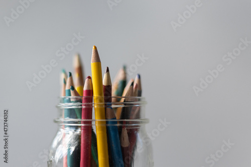Colored pencils in glass jar photo