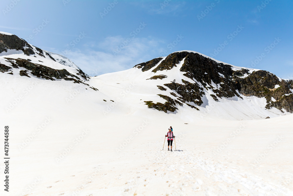 Woman Hiking in the High Snowy Mountain .Winter Vacation in Bulgaria ,Seven Rila Lakes Woman Hiking in the High Snowy Mountain .Winter Vacation in Bulgaria ,Seven Rila Lakes