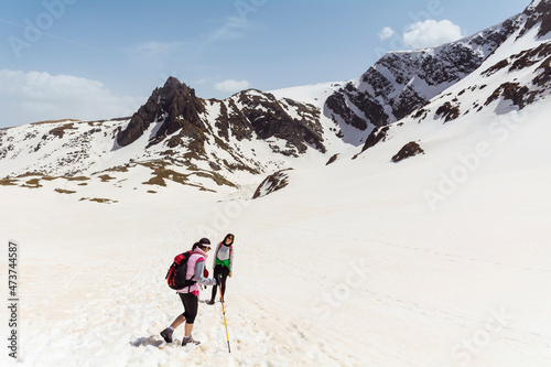 People Hiking in the High Snowy Mountain .Winter Vacation in Bulgaria ,Seven Rila Lakes  © boryanam