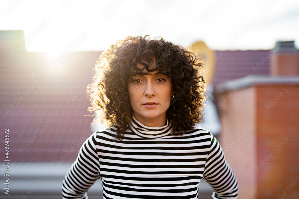 Young woman enjoying on a balcony. Young woman enjoying on a balcony.