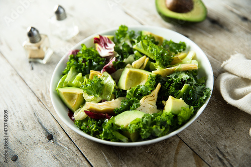 Healthy green salad with artichoke and avocado