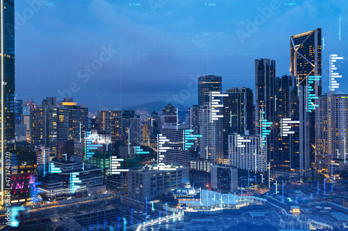 Photography Stock market graph hologram, night panorama city view of Kuala Lumpur