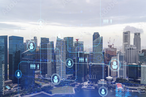 Social media icons hologram over panorama city view of Singapore, Asia. The concept of people networking, connections and career opportunities. Double exposure.