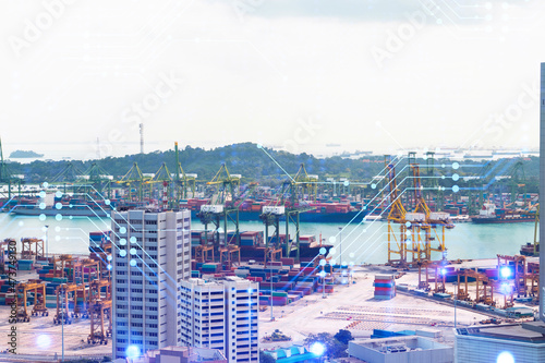 Technology hologram over panorama city view of Singapore. The largest tech hub in Asia. The concept of developing coding and high-tech science. Double exposure.