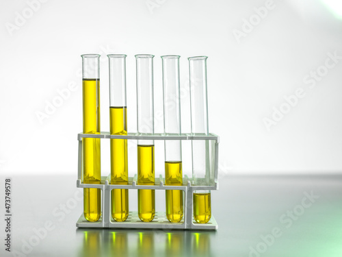Oil in test tubes on table