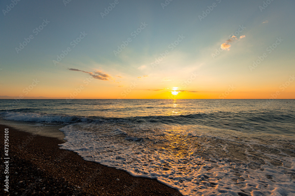 beautiful sunrise on the horizon of the blue sea beautiful sunrise on the horizon of the blue sea