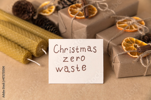 Christmas and zero waste  gifts in paper packaging  wax candles  pine cone tree  ecological holiday concept