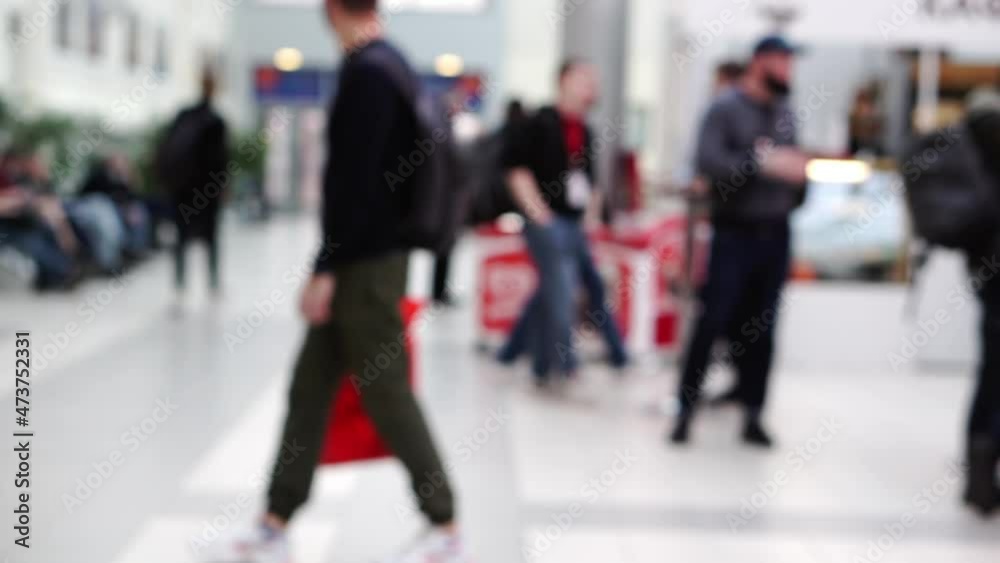 Blurry people in a bright business center lobby. Blurry people in a bright business center lobby.