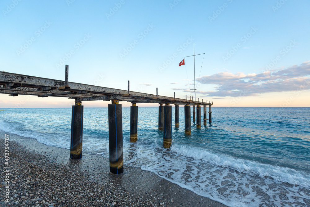 wooden sea pier with sun loungers