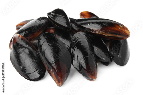 Heap of raw mussels in shells on white background