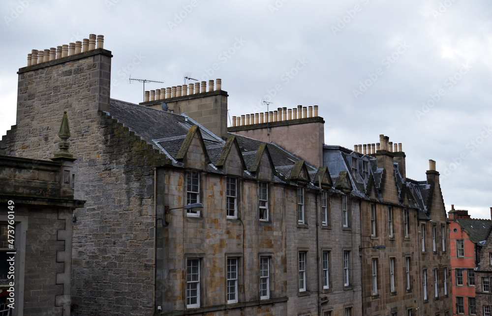 Facade & Roof with Chimneys of Old Stone  Residential Building 