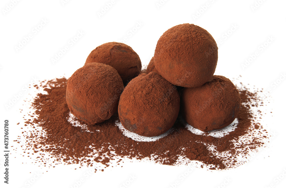 Delicious chocolate truffles powdered with cocoa on white background Delicious chocolate truffles powdered with cocoa on white background