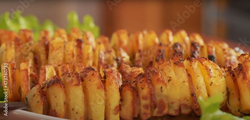 fried potato slices on a skewer