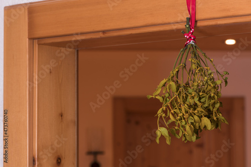mistletoe hanging from door frame for kissing