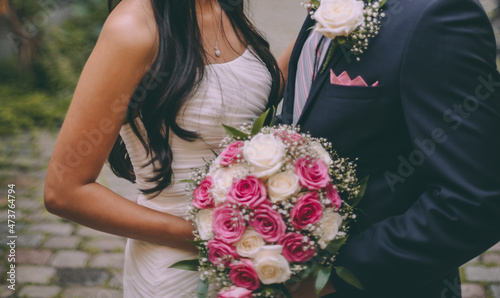 a bride from Latin America and caucasian groom, bridal couple in love, happy wedding day