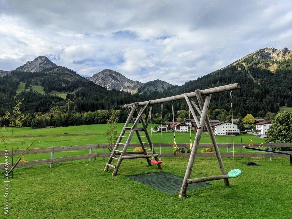 Kinder Playground with mountain view in Alps Austria Kinder Playground with mountain view in Alps Austria