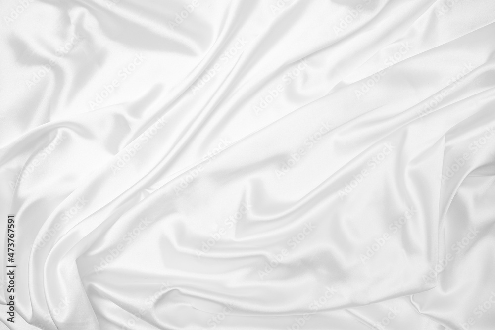 Creases of white satin, silk, and cotton. Abstract white fabric texture background. Creases of white satin, silk, and cotton. Abstract white fabric texture background.