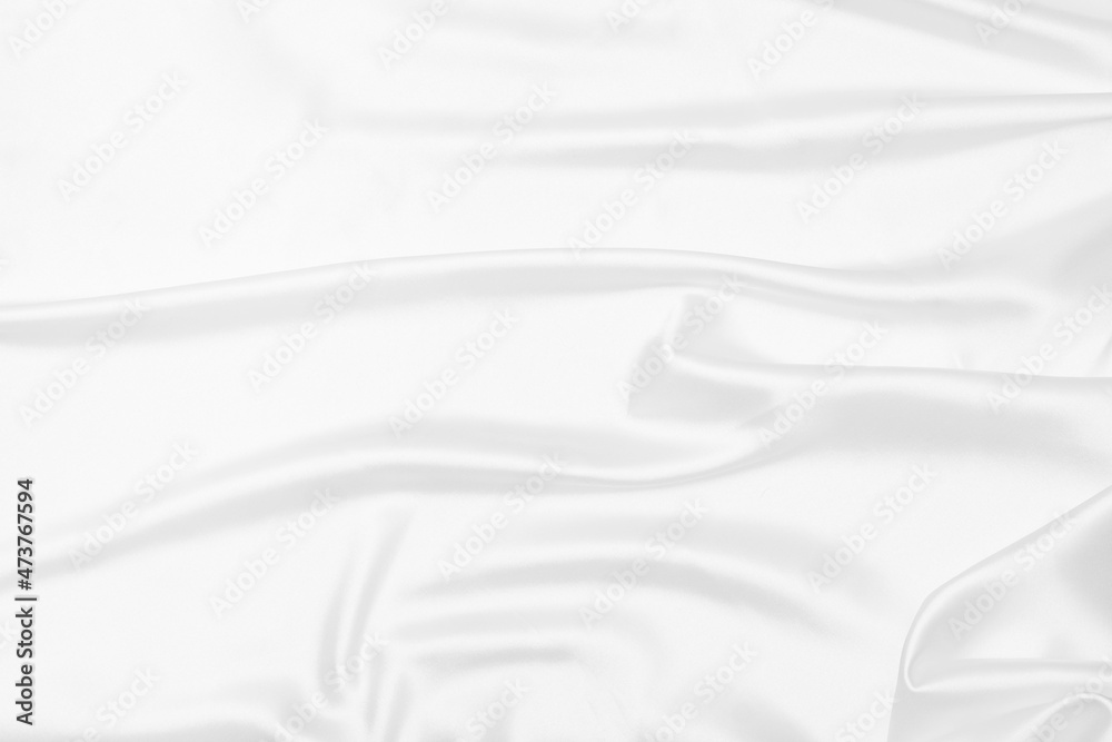 Creases of white satin, silk, and cotton. Abstract white fabric texture background. Creases of white satin, silk, and cotton. Abstract white fabric texture background.