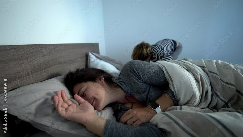 Mother lying in bed in the morning Mother lying in bed in the morning