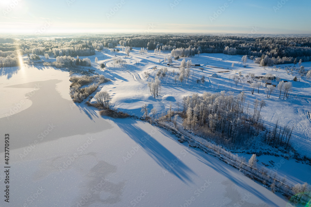 Aerial winter sunny frozen morning view of nature landscape