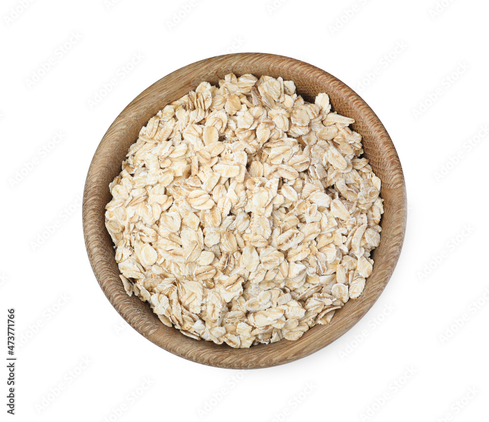 Raw oatmeal in wooden bowl isolated on white, top view Raw oatmeal in wooden bowl isolated on white, top view