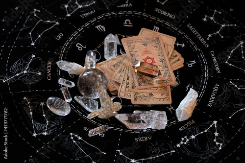 Fototapeta quartz minerals, crystal ball, vintage Tarot card on black divination napkin