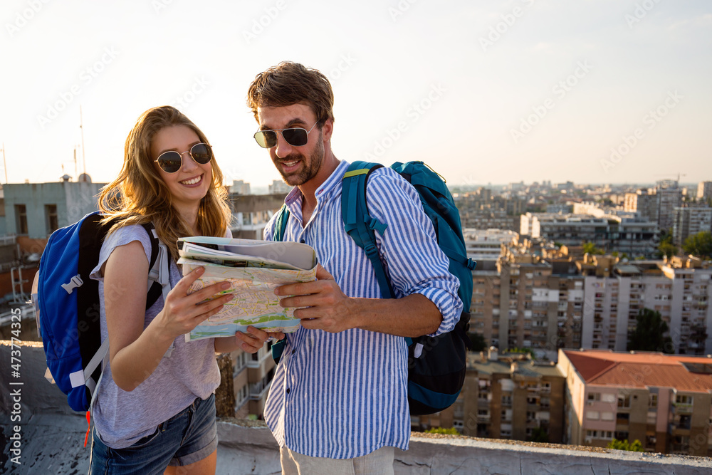 Holiday travel people tourism concept. Smiling couple having fun and enjoying summer vacation