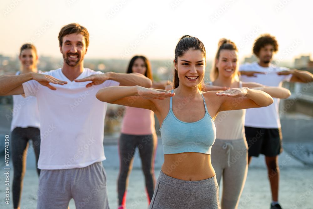Fitness sport friendship and healthy lifestyle concept. Group of happy  friends or people exercising Photos | Adobe Stock