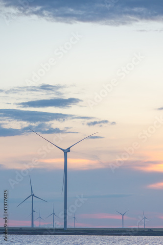 Wind turbines renewable energy source in the lagoon © Iermakov