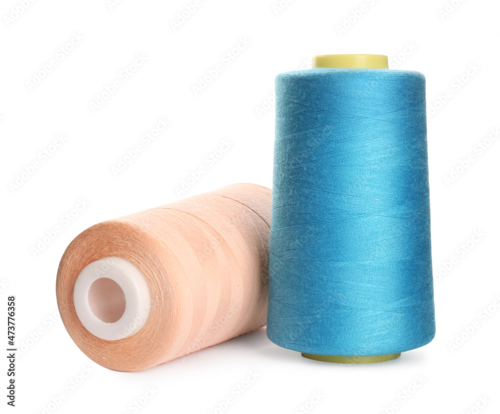Different colorful sewing threads on white background Different colorful sewing threads on white background