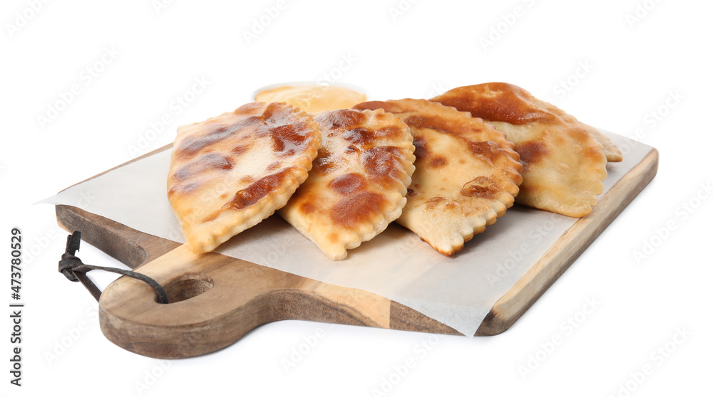 Delicious fried chebureki on wooden board against white background