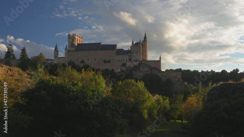 View of the Alcazar of Segovia in Spain at sunset  photo
