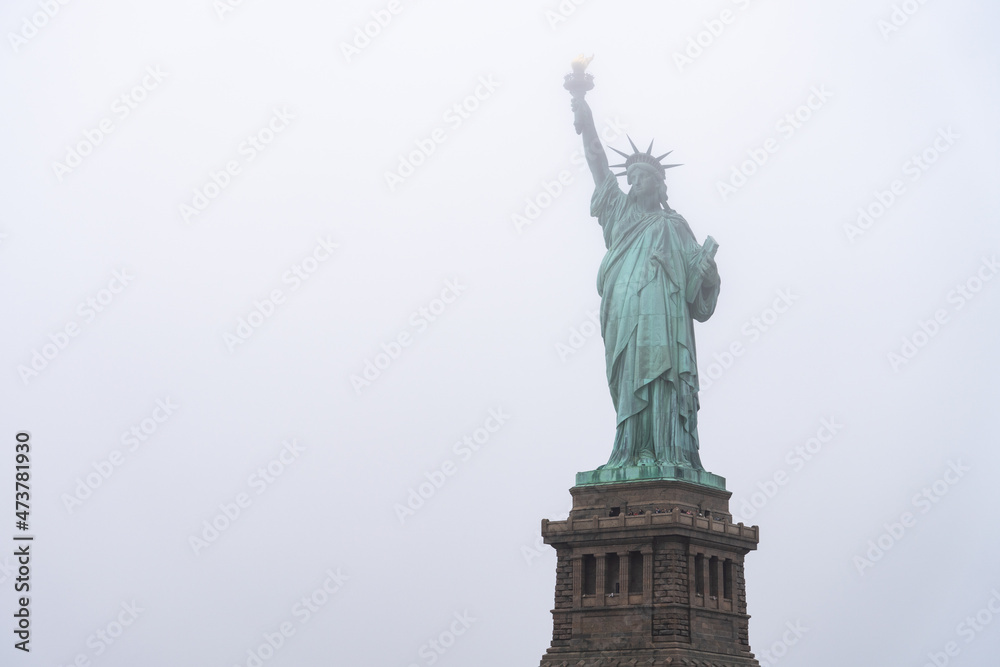 Fototapeta premium Statue of Liberty on a foggy winter day, New York City, USA