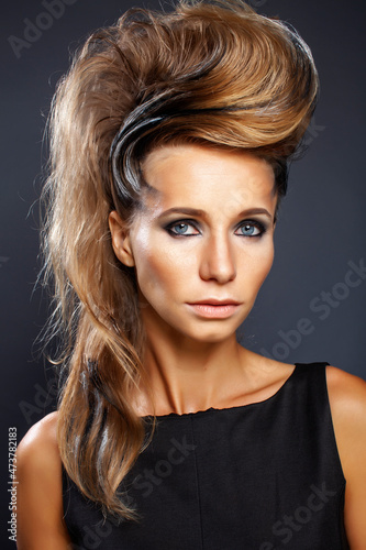 young elegant woman with creative hair style zebra print close up pretty like punk studio halloween look fashion