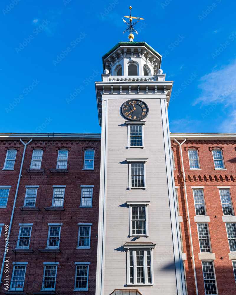 Clock Tower in an old mill located in New England specifically in Massachussetts. New England mill restored and now also living space, 