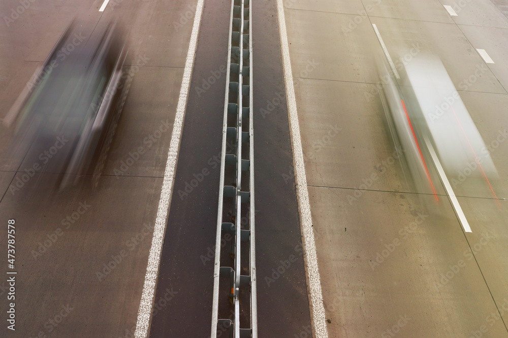 Top view of the highway on which the car is traveling. Long exposure photography