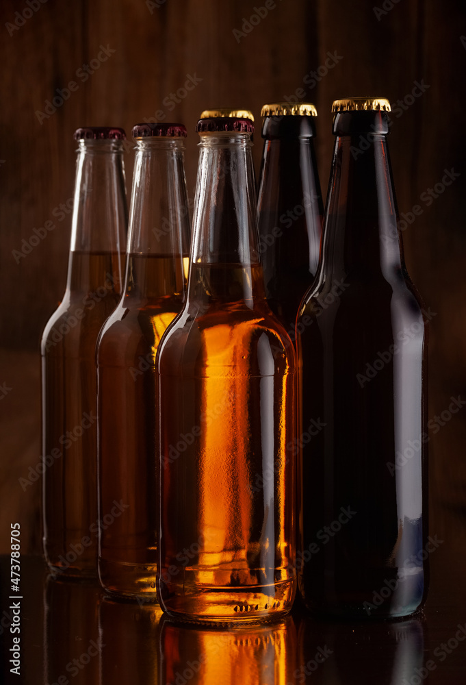 beer bottles on the background of a wooden wall beer bottles on the background of a wooden wall
