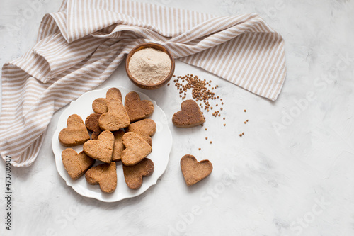 homemade heart-shaped cookies on a plate, Valentine's day gift with love, gluten-free buckwheat flour pastries.