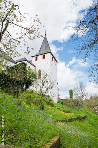 Germany, North Rhine-Westphalia, Kronenburg, Medieval church Saint Johann Baptist in spring photo